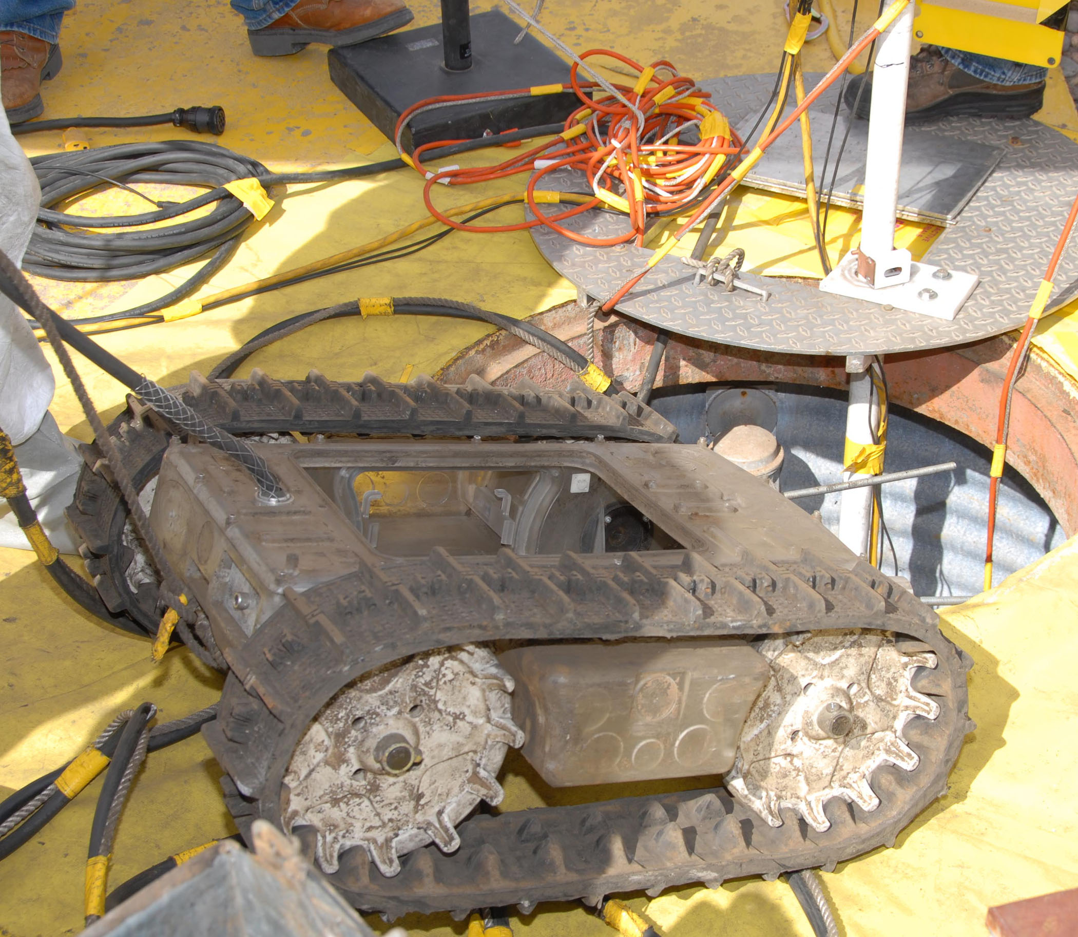 SWARMY EMERGES from wastewater storage tank. (Photo by Randy Montoya)