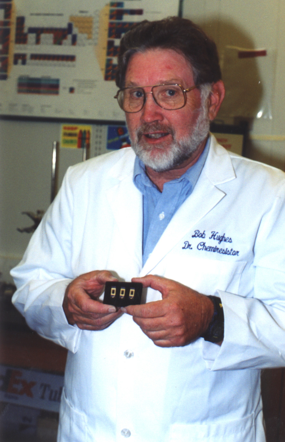 SANDIA RESEARCHER BOB HUGHES, “Dr. Chemiresistor,” holds chemiresistors that are part of the real-time gas- and water-quality monitoring system he and Cliff Ho developed.