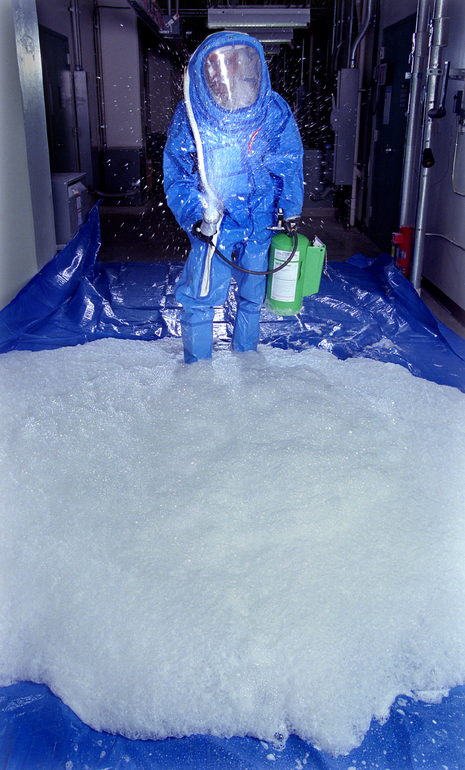 Sandia National Laboratories researcher and decon foam co-developer Maher Tadros demonstrates use of the Sandia-developed chem-bio decontamination formulation that is being used now now to help rid US facilities of anthrax contamination.