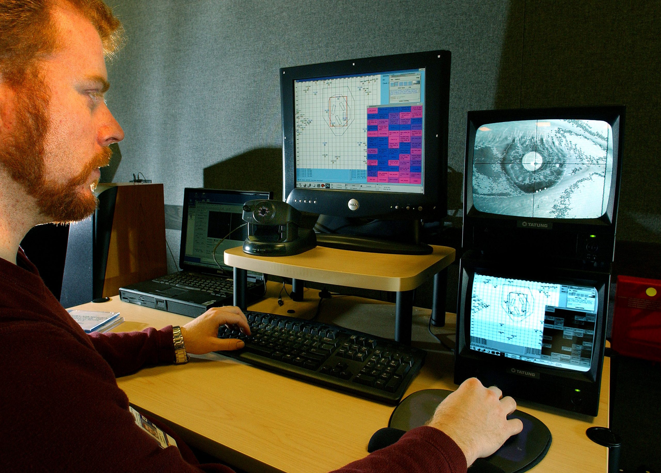 SANDIA SOFTWARE DEVELOPER Rob Abbott operates the DDD-AWACS simulation trainer while a cognitive model of the software runs simultaneously. The cognitive model can detect when Rob makes an error and alert him to it. (Photo by Randy Montoya)