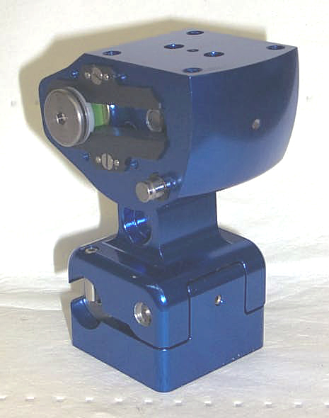 One version of a modern mechanical polycentric knee. It weighs 1.37 pounds, is 4.12 inches high. Its lower bases is 2x2 inches, and upper 3x2.5 inches.