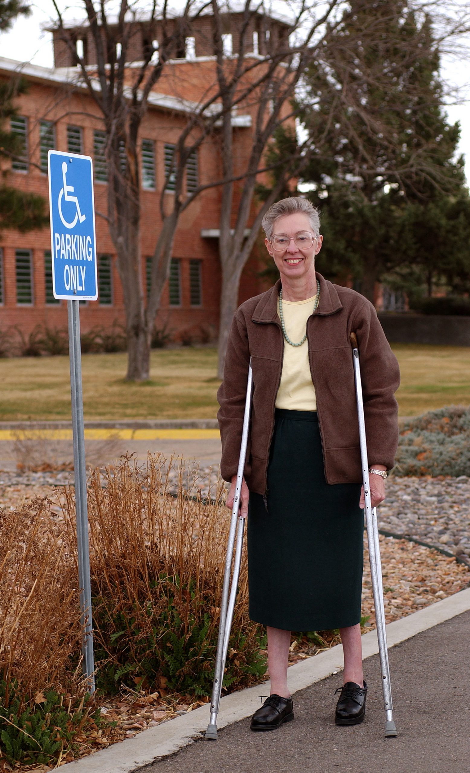 REGINA HUNTER helped establish new official handicap parking spots. For this and other activities with Sandia’s Disability Awareness Committee (DAC), she was named “Employee of the Year” by CAREERS & the disABLED magazine. (Photo by Randy Montoya)