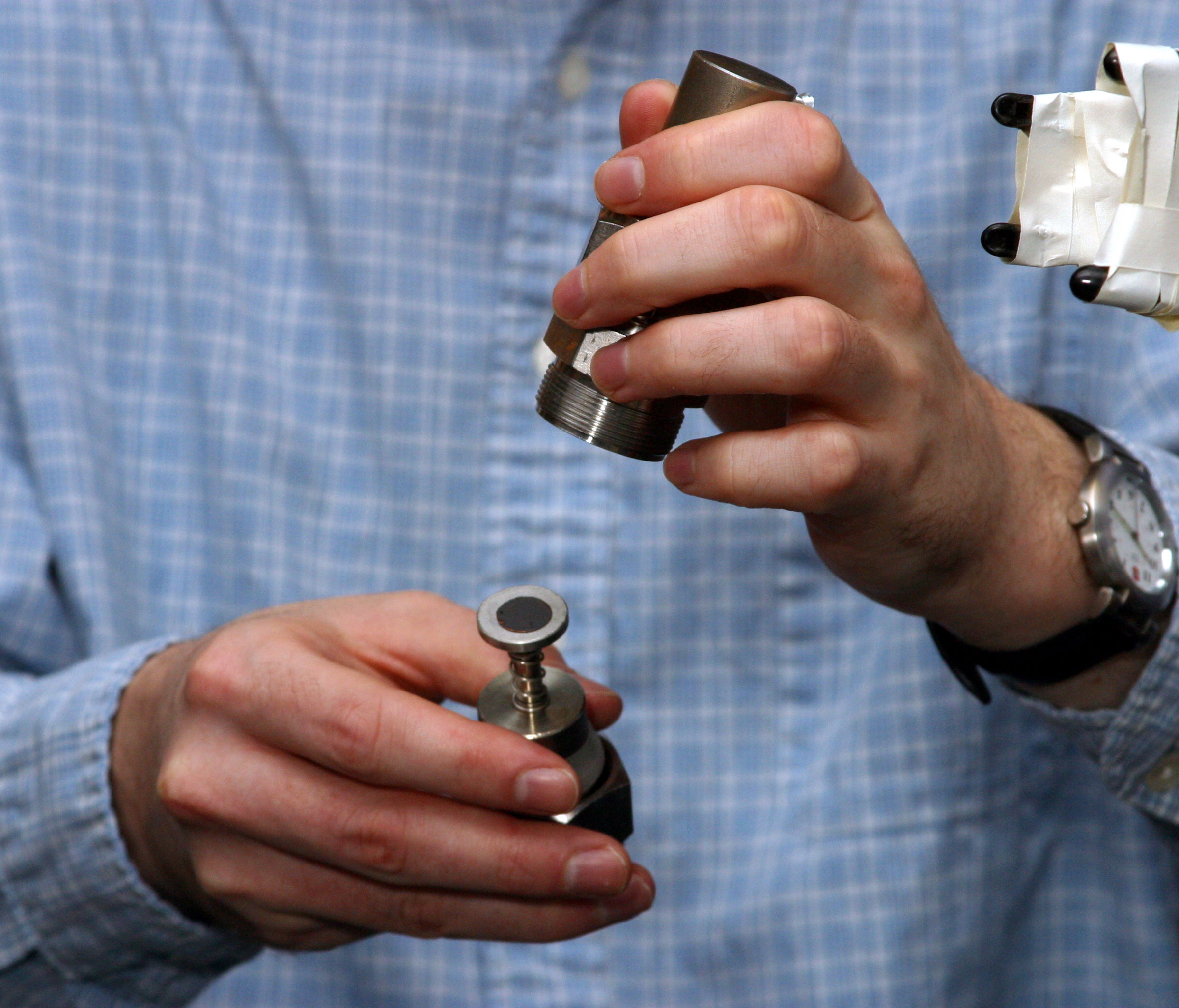 A Sandia researcher assembles an electrochemical cell to test the capacity of a silicon/graphite electrode. The silicon/graphite mix could improve by up to 400 percent the specific capabilities of commercial graphite anode materials.