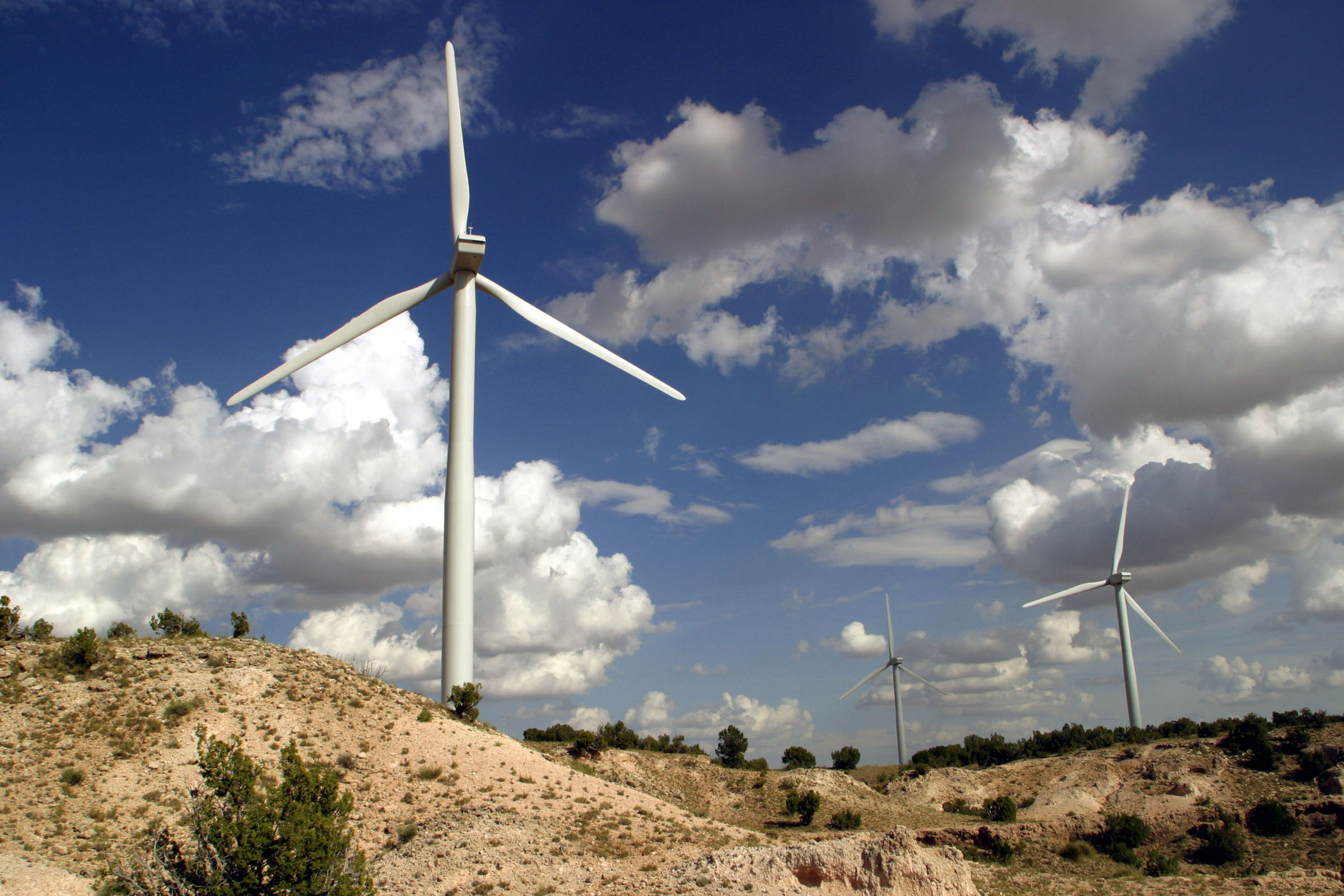 TURBINES SPIN at the New Mexico Wind Energy Center, located 170 miles southeast of Albuquerque and 20 miles northeast of Fort Sumner, which recently started producing electricity for PNM. The center, the world’s third-largest wind generation project, will be officially dedicated Oct. 1.