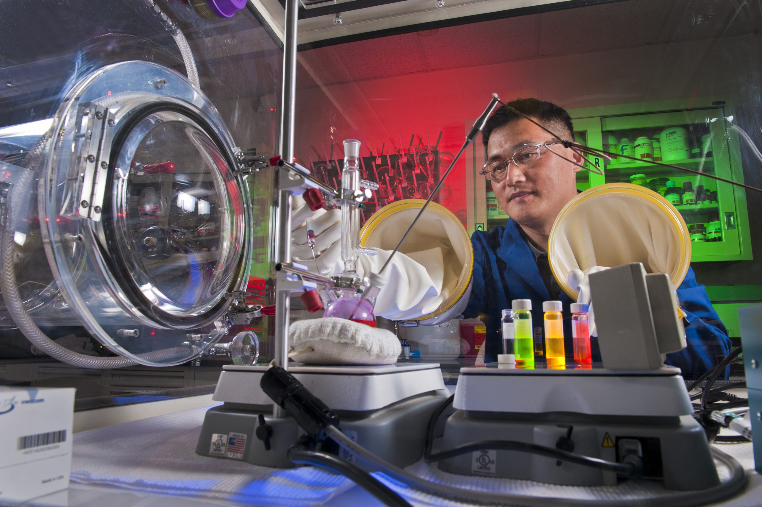 Hongyou Fan working with nanocoatings in his lab. Fan’s work in the field of nanoparticle assembly and integration has supported a shift from nanoscience discovery to practical nanotechnologies.