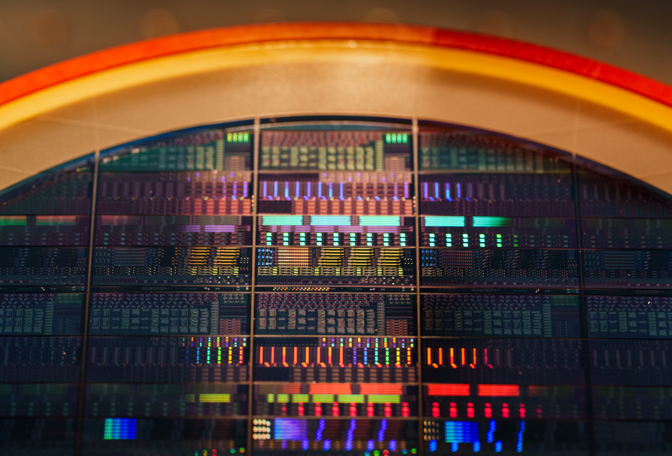 An 8-inch wafer fabricated at Sandia National Laboratories’ MESA complex for new acousto-optic device technologies. 