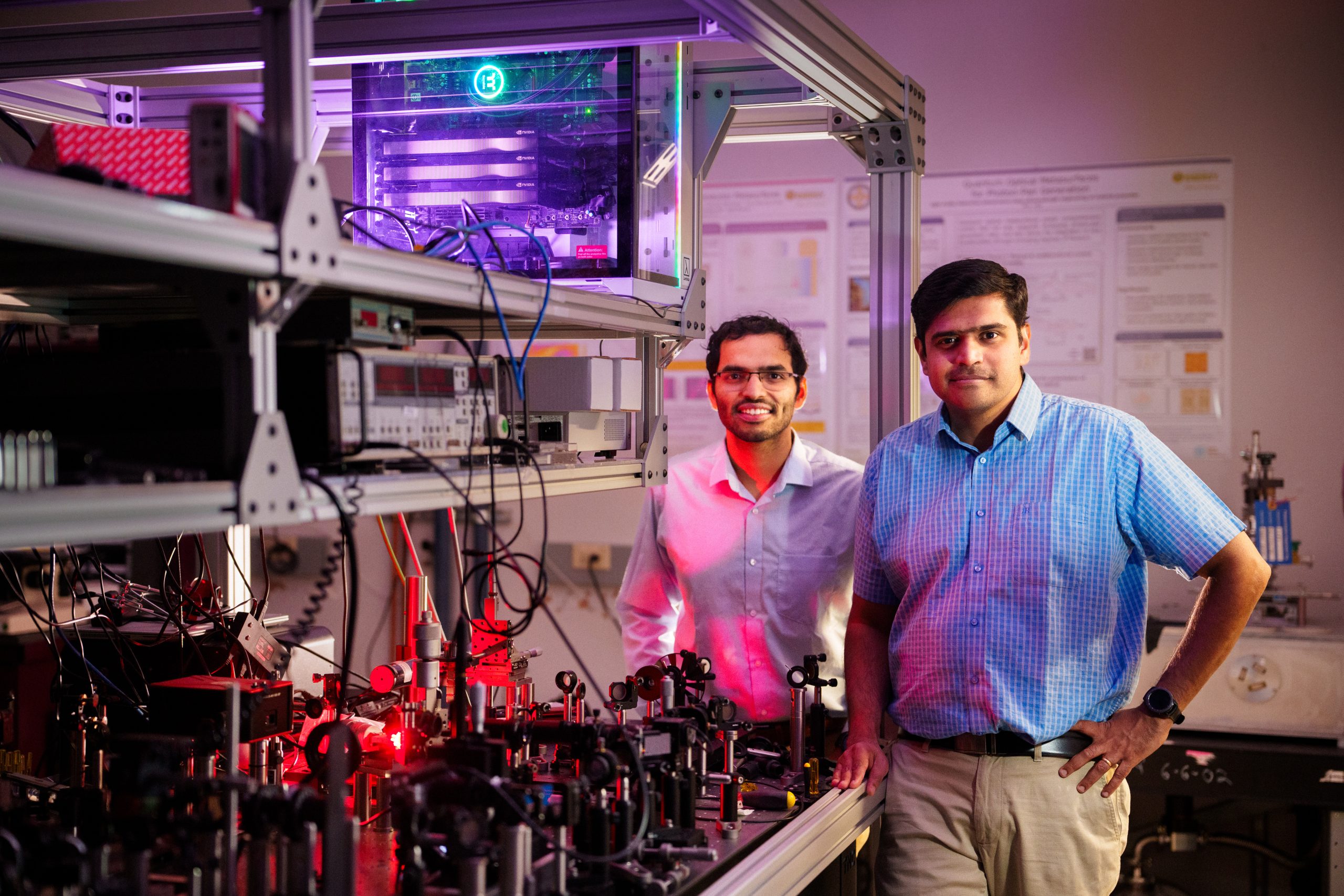 Saaketh Desai and Prasad Iyer stand together in their lab