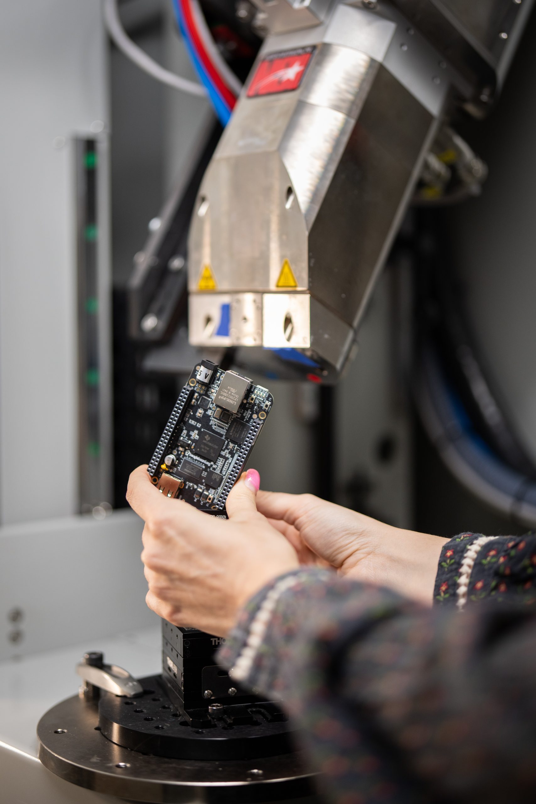 Noelle Collins sets up for an X-ray CT scan of a circuit board as part of the Non-Destructive Evaluation group at Sandia National Laboratories.  