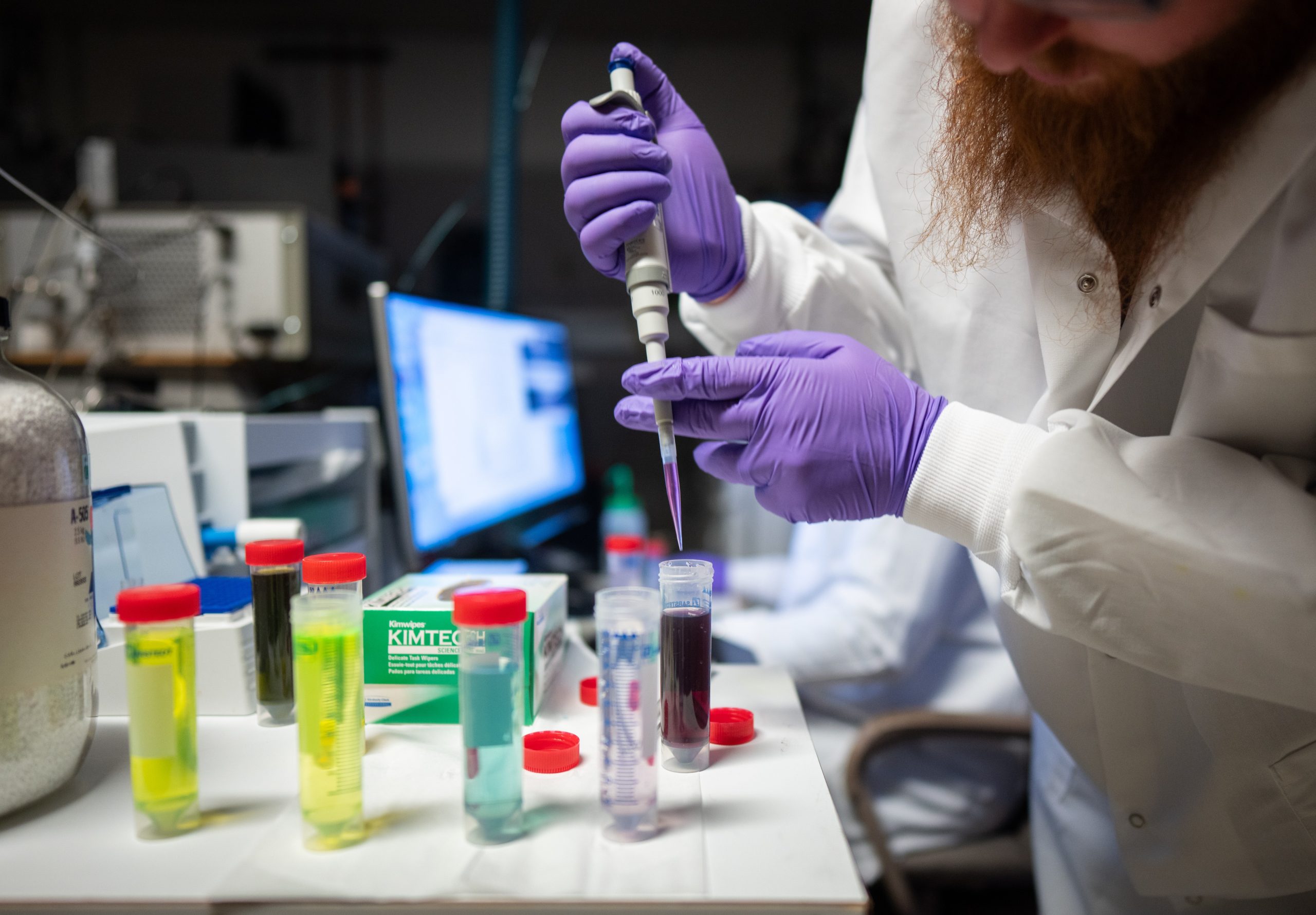 Nathan Bays prepares sample solutions to test the ISA-DESI technique used to detect PFAS at Sandia National Laboratories.