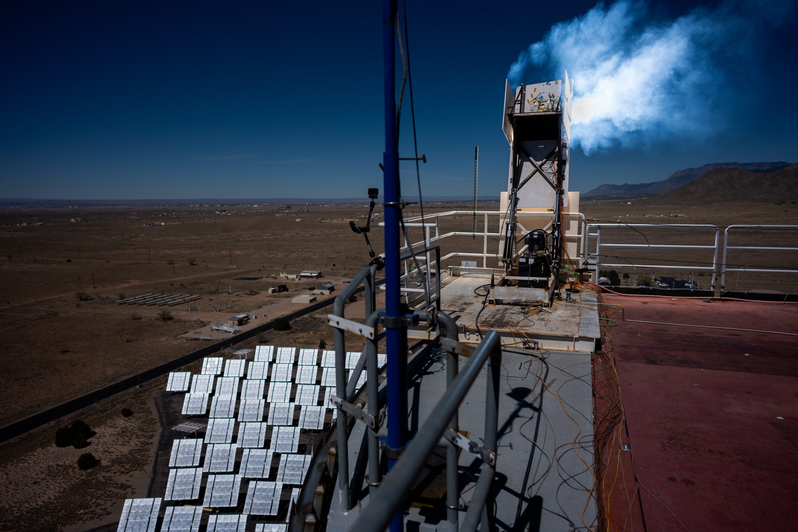 Hundreds of mirror-like heliostats concentrate sunlight on a sample of heat shield material at Sandia National Laboratories’ National Solar Thermal Test Facility. The material, developed by NASA’s Ames Research Center in California's Silicon Valley for the Dragonfly mission, was subjected to a pulse of heat that exceeded 4,500 degrees Fahrenheit.