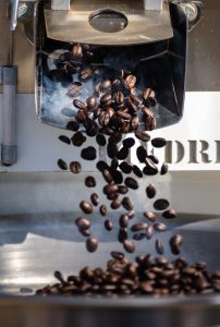 <strong>Coffee beans roasted using solar energy drop from a roaster at the National Solar Thermal Test Facility at Sandia National Laboratories. The project is a funded by the state of New Mexico. </strong>(Photo by Craig Fritz) Click on the thumbnail for a high-resolution image.