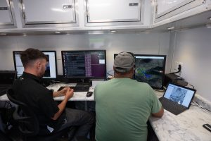 <strong>Crews at the command-and-control hub monitor data feeds during an exercise at Sandia National Laboratories designed to rapidly test deployable systems for military applications and border security. </strong>(Photo by David Lienemann) Click on the thumbnail for a high-resolution image.