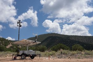 <strong>A portable sensor trailer system is set up with a telescoping pole, equipped with radar and high-definition cameras to detect drones during an exercise for the military. Ground surveillance radar is off to the right.</strong> (Photo by David Lienemann) Click on the thumbnail for a high-resolution image.