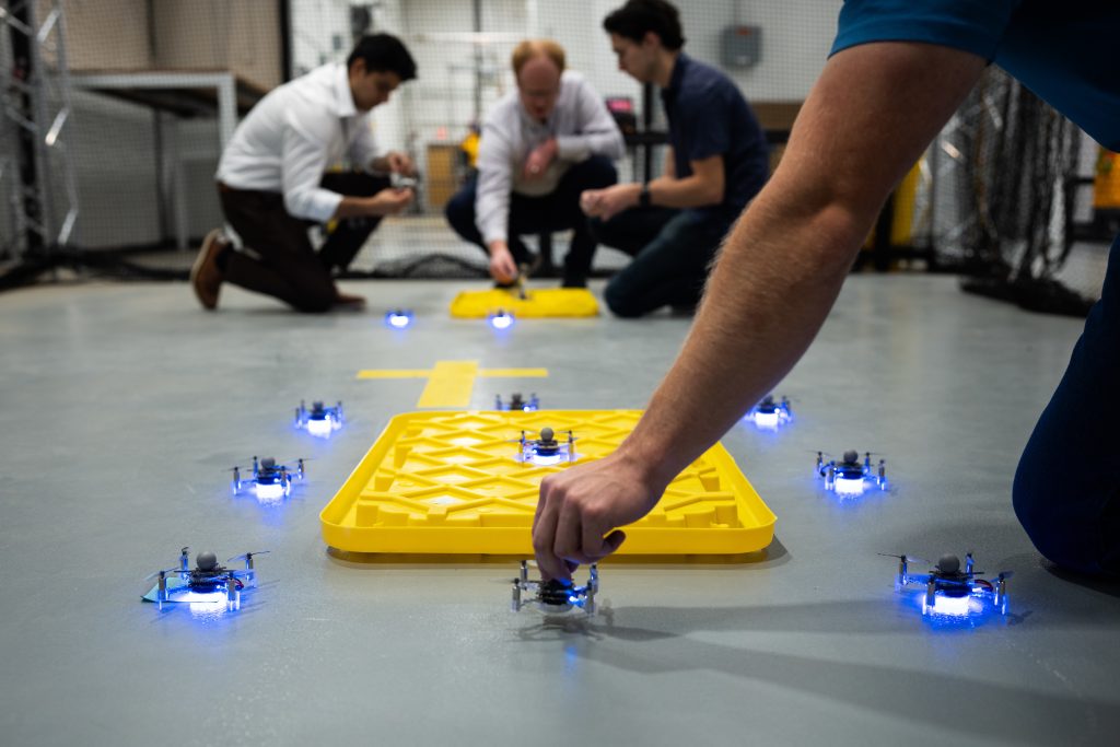 <strong>Sandia National Laboratories intern Cole Lill helps set up drones for a test at Sandia's Center for Advanced Manufacturing and Innovation.</strong> (Photo by Craig Fritz) Click on the thumbnail for a high-resolution image.