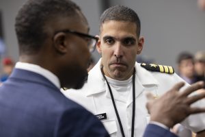 <strong>Pantex Field Office Deputy Manager Marcus Lea, left, speaks to Cmdr. Joshua Valiani, U.S. Navy, during a gathering at the Pantex Plant in Amarillo, Texas, to celebrate completion of the first production unit of the W76 Mark 4B reentry body. </strong>(Photo courtesy of Pantex) Click on the thumbnail for a high-resolution image.