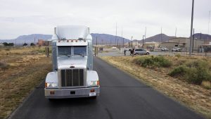 <strong>The second prototype of the Mobile Guardian Transporter test vehicle arrives at the sled track facility at Sandia National Laboratories for a head-on crash. Test results will help qualify the Mobile Guardian Transporter design, ahead of full-rate production. </strong>(Photo by Joel Ortiz) Click on the thumbnail for a high-resolution image.