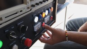 <strong>Firing set operator Paul Vinyard prepares to push the button that will initiate the rocket motors to propel the Mobile Guardian Transporter down the sled track at Sandia National Laboratories.</strong> (Photo by Bryn Whisenand) Click on the thumbnail for a high-resolution image.