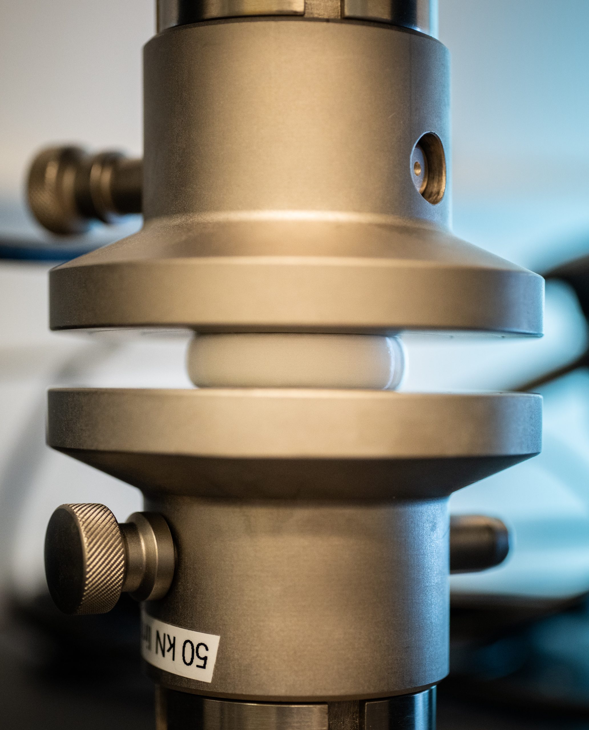 Mechanical testing of surrogate material is conducted using a load frame at Sandia National Laboratories. Subject matter experts at the Center for Advanced Manufacturing and Innovation helped manufacture surrogates, making new iterations in 12 hours rather than 12 weeks using low-cost material.