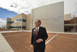 The Senator in front of the Pete V. Domenici National Security Innovation Center