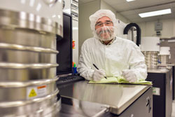 Sandia National Laboratories technologist Mike Lopez received the Thin Film Division Distinguished Technologist Award in 2016 from the American Vacuum Society. Lopez, posing in a Sandia clean room, was recognized for exceptional technical support of thin film research and development. (Photo by Randy Montoya) Click on thumbnail for a high-resolution image.