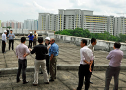 Dan Borneo, center in blue shirt, and other researchers from Sandia National Laboratories met with government representatives in the Southeast Asian island city-state of Singapore. Sandia will help Singapore’s Energy Market Authority set up the country’s first grid energy storage test-bed through a Comprehensive Research and Development Agreement. (Photo courtesy of Sandia National Laboratories) Click on the thumbnail for a high-resolution image.