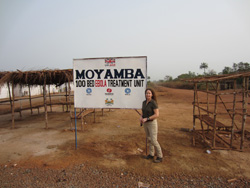 Paula Austin outside an Ebola treatment unit in Sierra Leone.