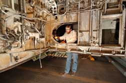 Kevin Howard prepares to acquire PASD data on electrical wiring in the wheel well of a retired Boeing 727