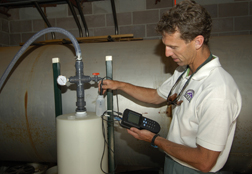 SANDIA RESEARCHER Brian Dwyer checks out arsenic removal equipment at Casa Angelica. The facility's well provides drinking and bathing water to 16 medically fragile children and young adults who live there.  