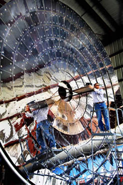 Sandia researcher Rich Diver checks out the solar furnace which will be the initial source of concentrated solar heat for the CR5 prototype. Eventually parabolic dishes will provide the thermal energy.