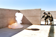 Lt. Chris Dallas and Tristan DeSantis demonstrate the fuel air diversionary device technology.