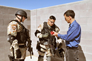 Lt. Chris Dallas and Tristan DeSantis check the flash-bang device.