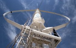 Photo looking up the tall tower of Sandia National Laboratories’ experimental 34-meter-diameter, vertical-axis wind turbine built in Texas in the 1980s.