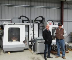 Chris Bergh in front of CNC machines